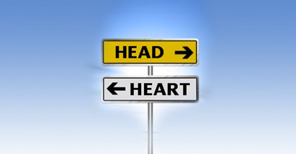 Head vs Heart Head - Road sign pointing in different directions